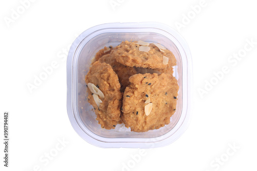 Whole grains cookies in clear plastic box isolated on white background