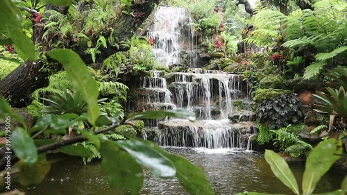 Natural waterfall in the forest is rich, beautiful and shady.