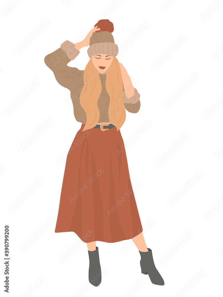Beautiful portrait of a woman in winter. Smiling girl wearing warm clothes having fun. She is wearing hat, sweater and long skirt isolated on white wall Beautiful portrait of a woman in winter. Smiling girl wearing warm clothes having fun. She is wearing hat, sweater and long skirt isolated on white wall