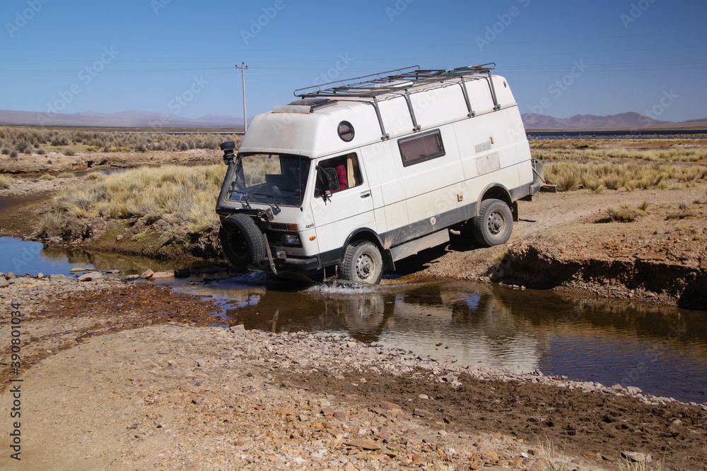 4x4 Offroad Camper Van crossing creek in Bolivia 4x4 Offroad Camper Van crossing creek in Bolivia