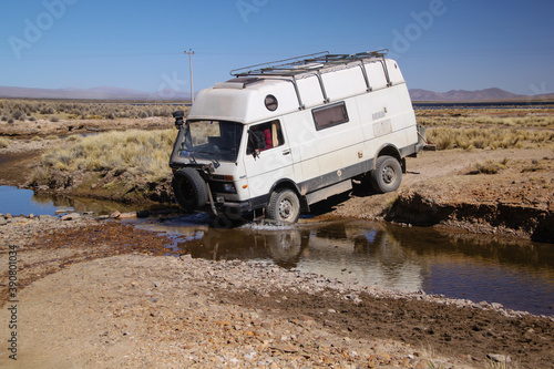 4x4 Offroad Camper Van crossing creek in Bolivia
