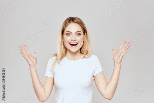 Wallpaper Mural Cute blonde white t-shirt gesture with hands lifestyle light background Torontodigital.ca