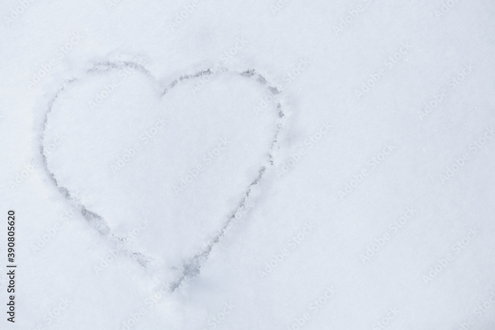 One heart in the snow. A heart is drawn on the snow close-up. The shape of heart on the snow. Winter background.. One heart in the snow. A heart is drawn on the snow close-up. The shape of heart on the snow. Winter background..