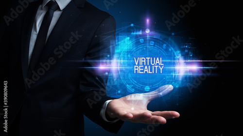 Man hand holding VIRTUAL REALITY inscription, technology concept