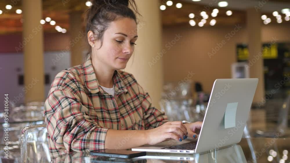 Woman working with laptop on Desktop. Woman Blogger Freelancer Working on Laptop at Cafe Woman working with laptop on Desktop. Woman Blogger Freelancer Working on Laptop at Cafe