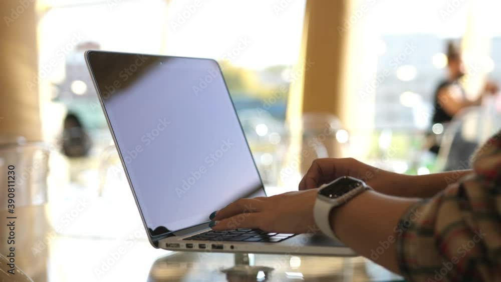 Woman working with laptop on Desktop. Woman Blogger Freelancer Working on Laptop at Cafe Woman working with laptop on Desktop. Woman Blogger Freelancer Working on Laptop at Cafe