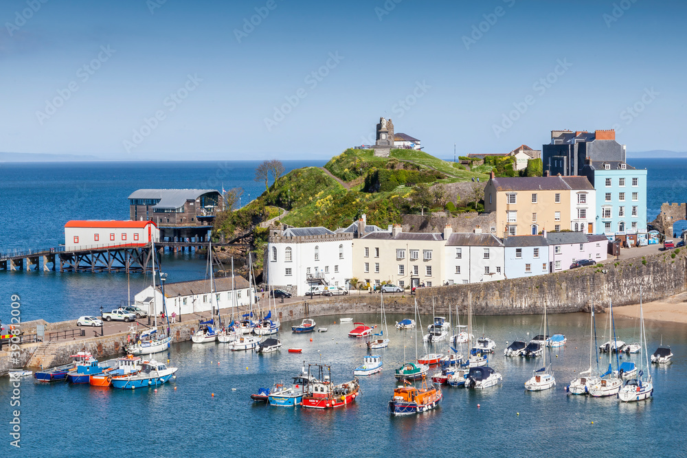Tenby Harbour Pembrokeshire Wales which is a popular seaside resort town and a popular travel destination tourist attraction landmark, stock photo image
