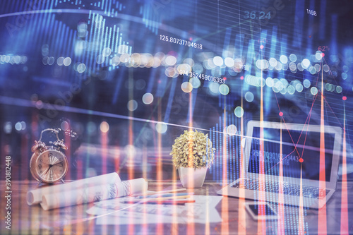 Stock market graph and table with computer background. Multi exposure. Concept of financial analysis.