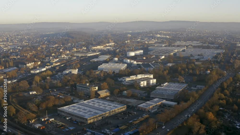 Drone shot of the cityscape landscape of Kassel in beautiuful soft sunlight and covered in fog. Typical german urban living, Germany, Europe. Drone shot of the cityscape landscape of Kassel in beautiuful soft sunlight and covered in fog. Typical german urban living, Germany, Europe.
