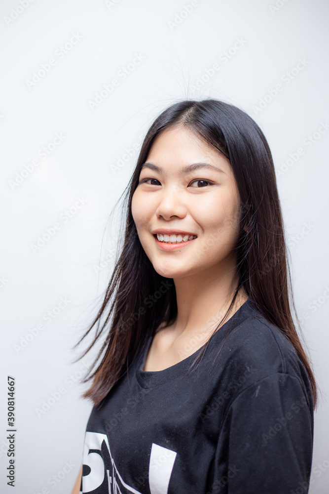Young beautiful asian female posing with black t-shirt. Young beautiful asian female posing with black t-shirt.