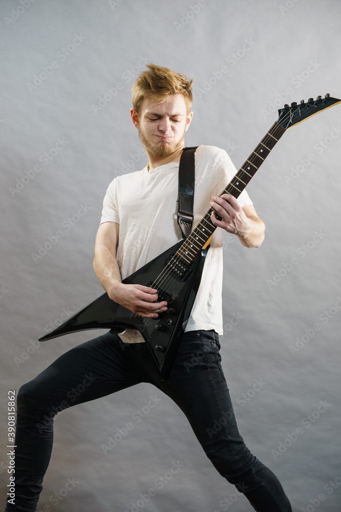 Fototapeta premium Man playing on electric guitar