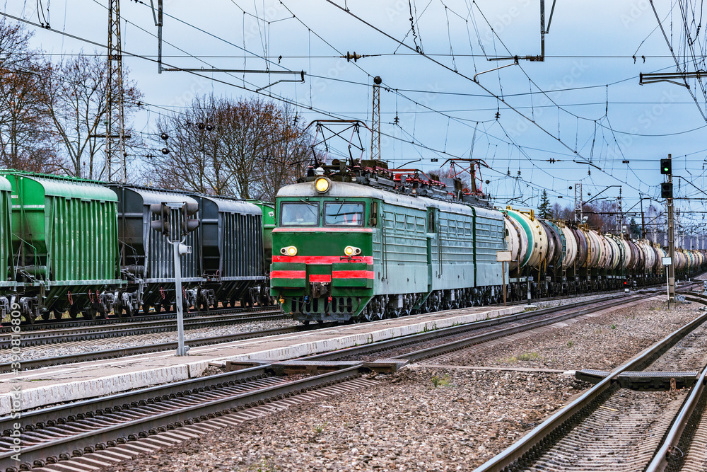 Freight train moves on the station. Trans Siberian railway.