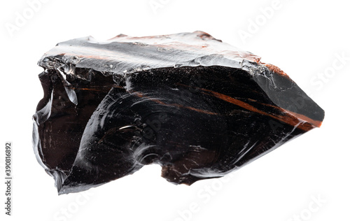 macro photography of sample of natural mineral from geological collection - raw Obsidian (volcanic glass) isolated on white background