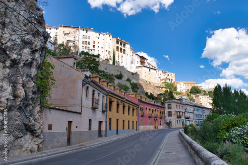 Huecar street in the city of Cuenca with its traditional white houses, Spain photo