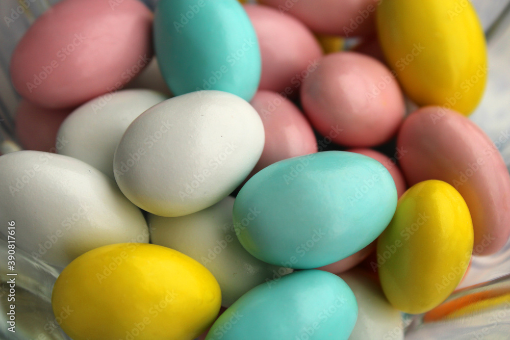 Almond candies close up view, colored sweets background Almond candies close up view, colored sweets background