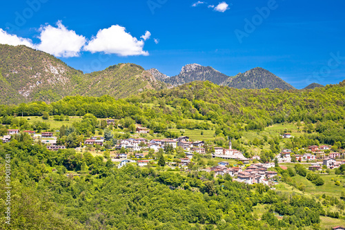 Idyllic village in Dolomites Alps above Garda lake view