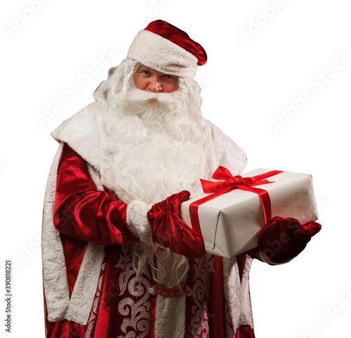 Russian Santa Claus (Ded Moroz) in a red caftan with a white box of gifts tied with a red ribbon isolated on white background