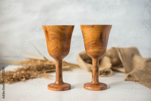 Glass made of wood. Craft wooden glass. Handmade wooden tableware.