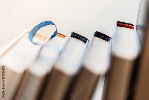 Many colorful books on the shelf.