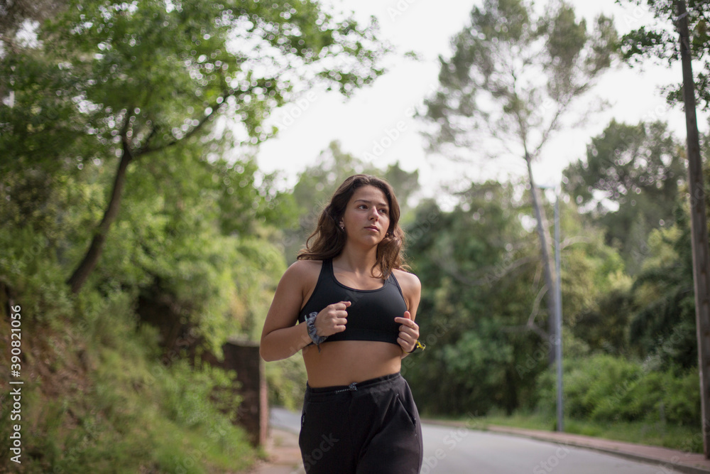 Woman running outdoors Woman running outdoors
