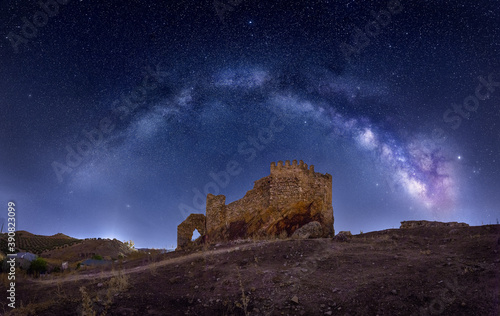 Old Mysterious castle under the Milky Way arch
