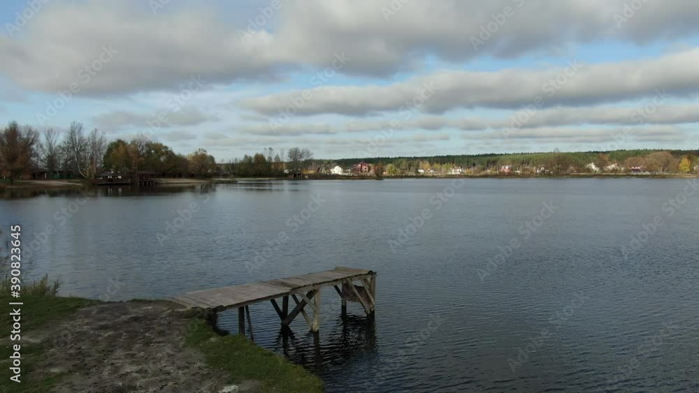 An old wooden platform builds near the water An old wooden platform builds near the water