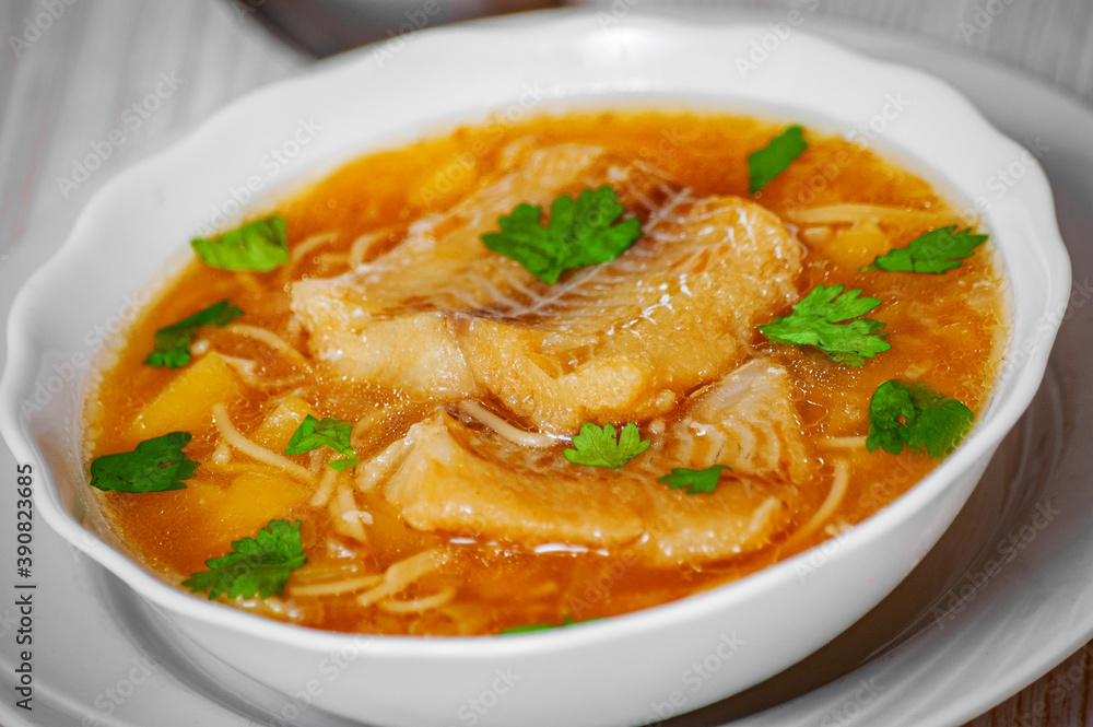 Fish soup with potato and noodles in bowl Fish soup with potato and noodles in bowl