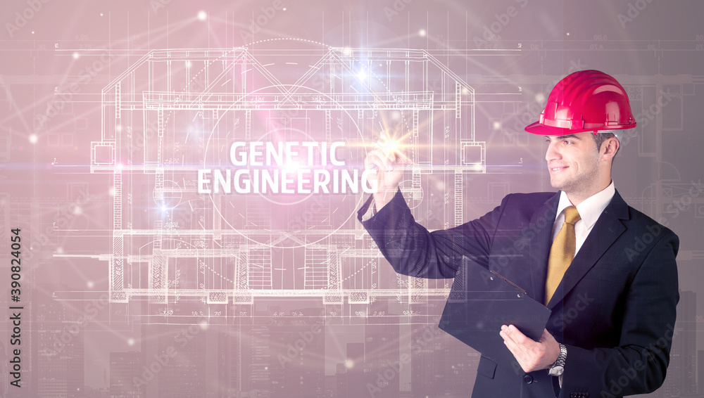 Handsome architect with helmet drawing GENETIC ENGINEERING inscription, new technology concept Handsome architect with helmet drawing GENETIC ENGINEERING inscription, new technology concept