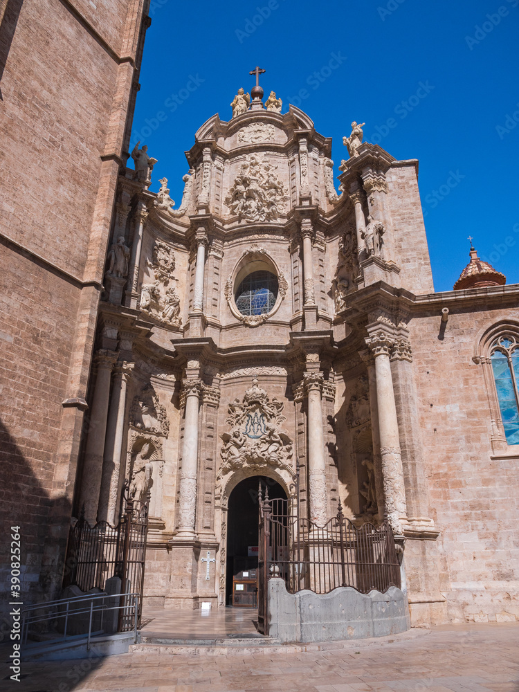 Beautiful entrance facade of the Santa Catalina church in Valencia, Spain. Valencian gothic roman catholic architecture. Beautiful vertical photo.