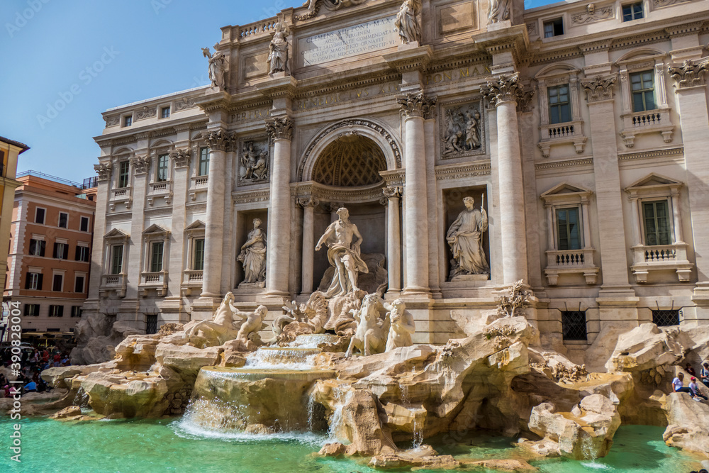 The famous Fountain of Trevi in Rome with blue sky