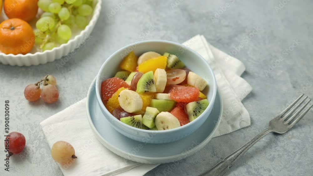 Close-up of a bowl of fruit salad with honey poured on it Close-up of a bowl of fruit salad with honey poured on it