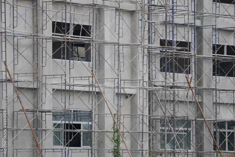 building under construction with scaffolding building under construction with scaffolding