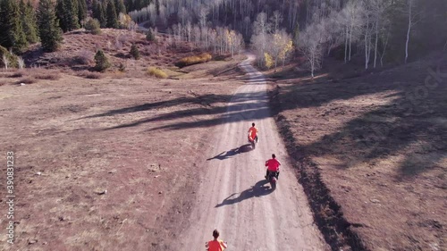 3 Tote Gotes riding on a mountain road photo