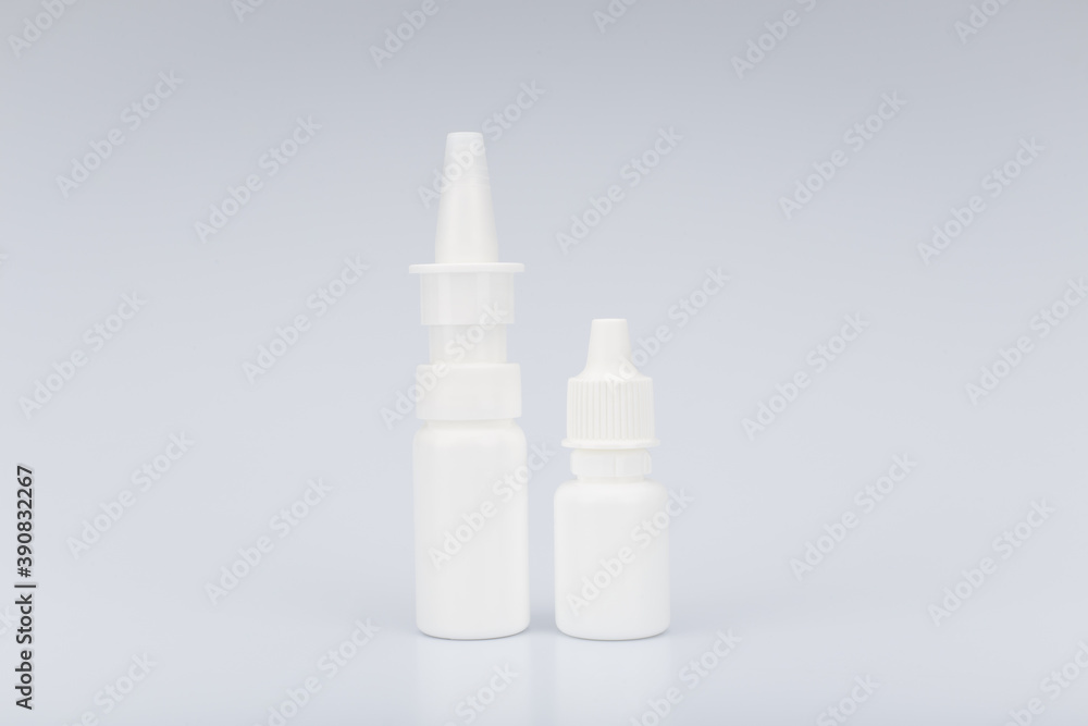 Unbranded white nasal and eye drops on light grey background Unbranded white nasal and eye drops on light grey background