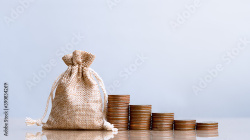 Coins in sack and coins stack , Pension fund, 401K, Passive income, Investment and retirement concept. savings and making money, Business investment growth concept. Risk management. photo