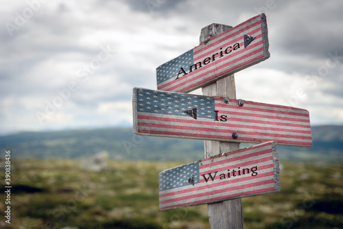 America is waiting text on wooden signpost outdoors with the american flag to simulate the 2020 presidential election.