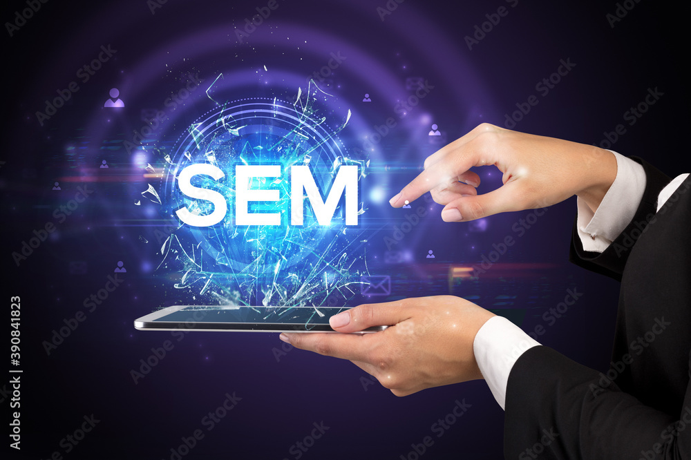 Close-up of a touchscreen with SEM abbreviation, modern technology concept Close-up of a touchscreen with SEM abbreviation, modern technology concept