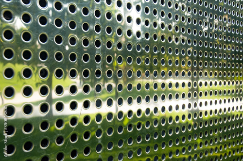 metal perforated chrome sheet for facade finishing. High quality photo