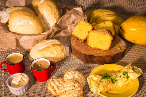 colonial breakfast típic from south of brazil, with many types food,cake,cookie,omelet and fruits... photo