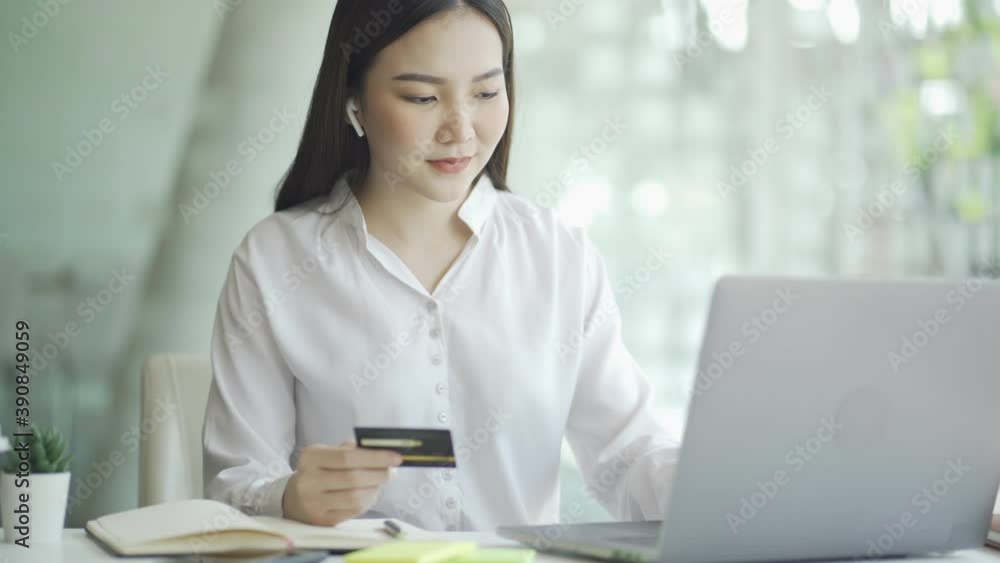 Happy asian woman using credit card and smartphone for online payment, Digital shopping lifestyle, 4k hands held video. Happy asian woman using credit card and smartphone for online payment, Digital shopping lifestyle, 4k hands held video.