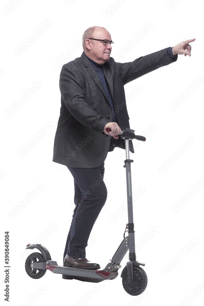side view . Mature man with electric scooter looking forward side view . Mature man with electric scooter looking forward