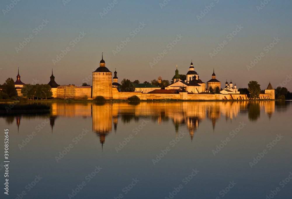 The view on the Kirillo-Belozersky Monastery reflecting in the river at sunset in Vologda region, Russia.
