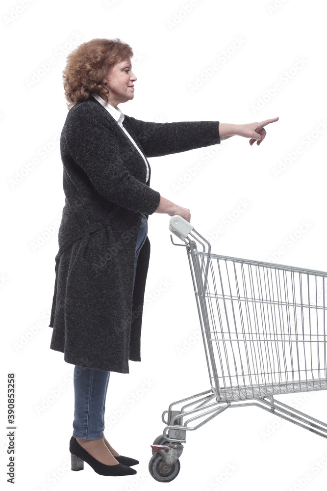 side view. casual woman with shopping cart looking forward side view. casual woman with shopping cart looking forward