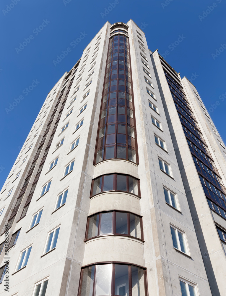 glazed with tinted glass, a new reinforced concrete building glazed with tinted glass, a new reinforced concrete building