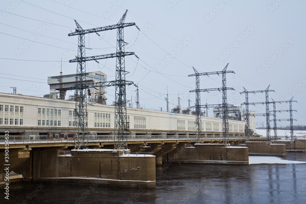 The dam of Hydroelectric power station on the Kama river in winter in Perm, Russia. The dam of Hydroelectric power station on the Kama river in winter in Perm, Russia.