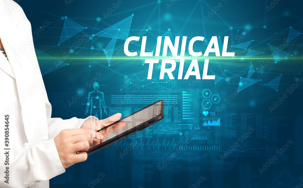 doctor writes notes on the clipboard with CLINICAL TRIAL inscription, medical diagnosis concept doctor writes notes on the clipboard with CLINICAL TRIAL inscription, medical diagnosis concept