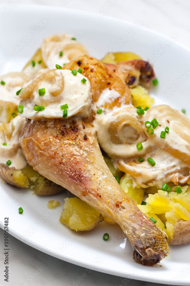 chicken leg on creamy onion sauce with potatoes chicken leg on creamy onion sauce with potatoes