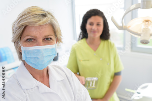 dentist and dental assistant posing