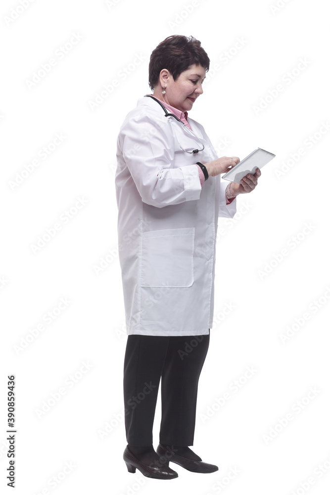 in full growth. female doctor reading a message on a digital tablet. in full growth. female doctor reading a message on a digital tablet.