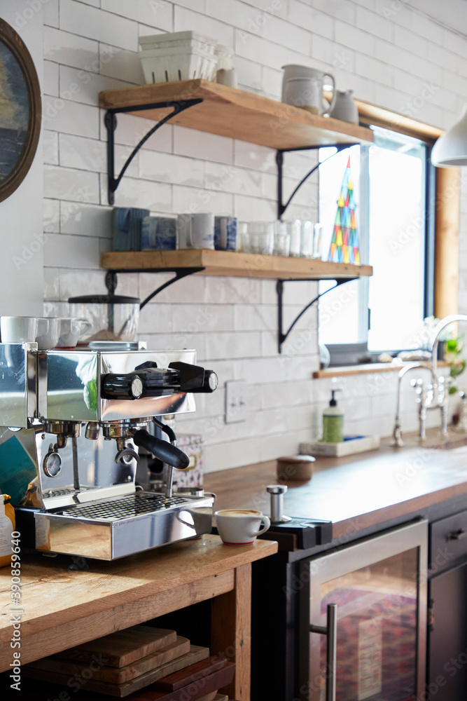Kitchen detail with espresso machine and since in view. Kitchen detail with espresso machine and since in view.